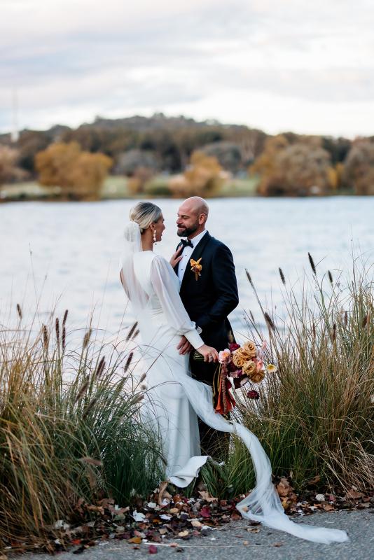 Karen Willis Holmes Real Bride Bec wearing her crepe wrap style Olive wedding gown from the Elope Collection with statement sleeves finished with a button cuff and open low back to her modern Australian wedding featured in Hello May Magazine Real Wedding Special.