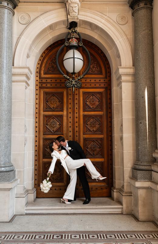 Karen Willis Holmes Real Bride Louise wearing her modern two piece bridal suit set. The Charlie Jacket & Danielle Pants from KWH Bridal's Elope Collection. Louise & Kalim had their registry Elopement ceremony in Melbourne CBD at the Old Treasury Building.