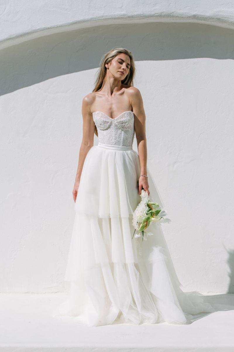 Annika & Matilda is the perfect wedding dress princess gown. The Annika Bodice is romantic and elegant with hand sewn lace detailing over a sheer corset. While the Matilda skirt is soft and flowy, with layers of tulle. photography by Daina Hazel