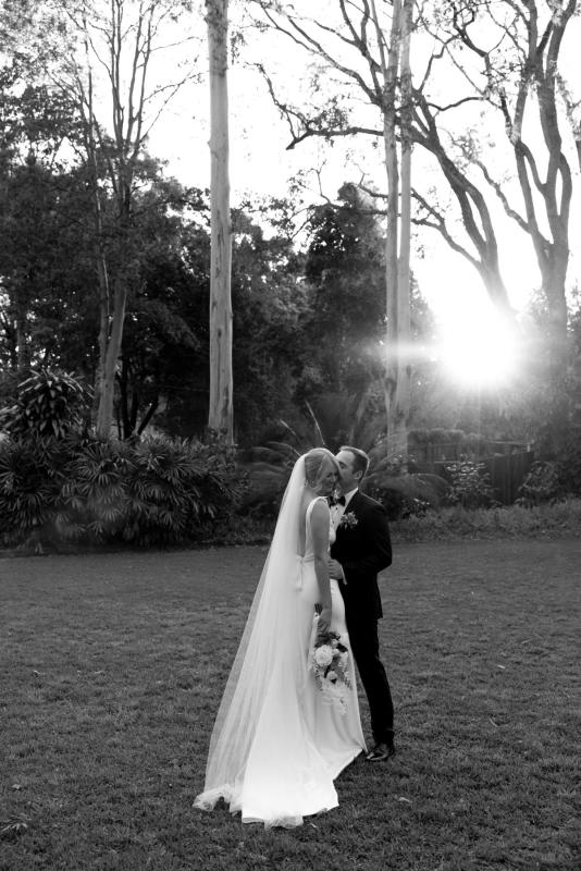 Real bride wearing beautiful opulence fabric athena gown from our elope collection