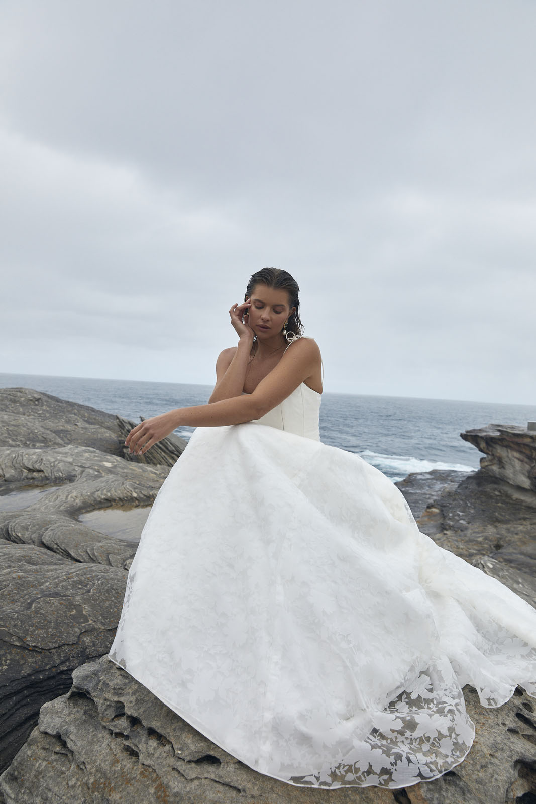 The Bernice Basque & Amelia wedding dress from KWH Bridal - Karen Willis Holmes - Scoop neckline basque wedding dress with A-line skirt with pockets in a Mikado fabric topped with burnout floral pattern organza