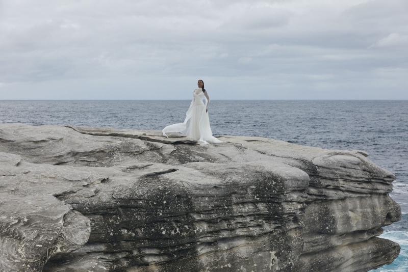 The Capri wedding dress from KWH BRIDAL – Karen Willis Holmes – Drop waist draped tulle mermaid princess gown with peaked bodice cups styled with a long scarf