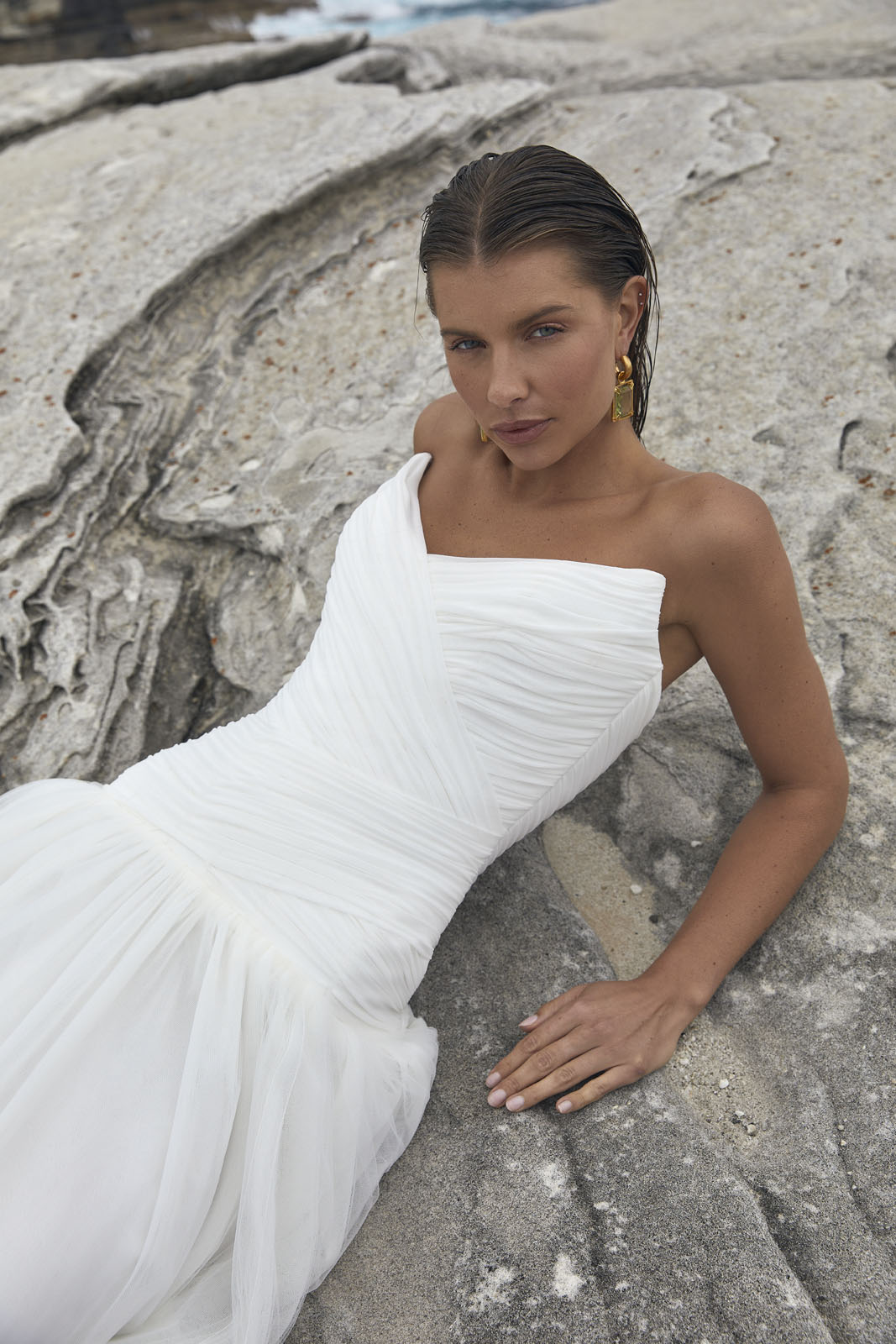 The Capri wedding dress from KWH BRIDAL – Karen Willis Holmes – Drop waist draped tulle mermaid princess gown with peaked bodice cups styled with a long scarf