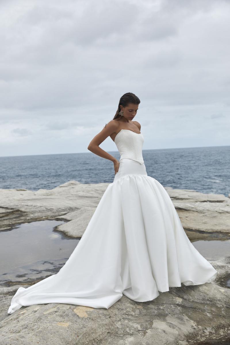 The Raine Dip & Adrianna wedding dress from KWH BRIDAL – Karen Willis Holmes - Basque waist beaded bodice with drop waist princess skirt with pockets & split