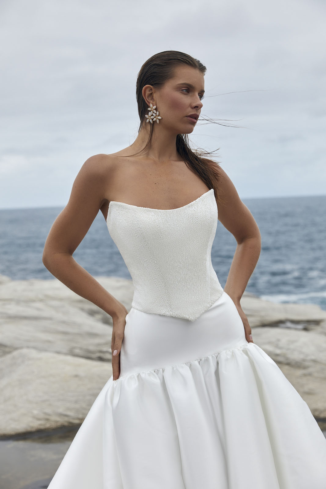 The Raine Dip & Adrianna wedding dress from KWH BRIDAL – Karen Willis Holmes - Basque waist beaded bodice with drop waist princess skirt with pockets & split