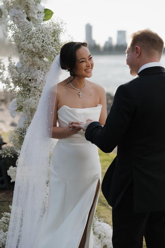 The Lou-Lou & Betsy wedding dress by KWH Bridal is a corset strapless draped gown with side split skirt detail for the modern minimal sexy bride