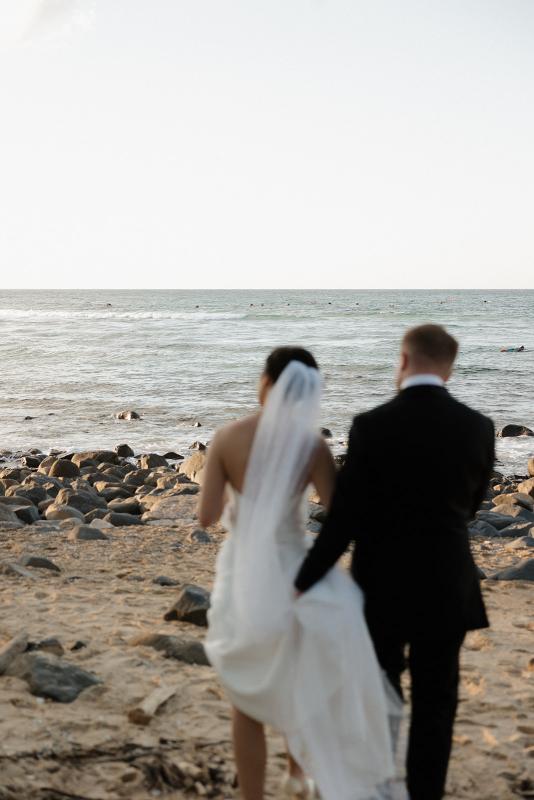 The Lou-Lou & Betsy wedding dress by KWH Bridal is a corset strapless draped gown with side split skirt detail for the modern minimal sexy bride