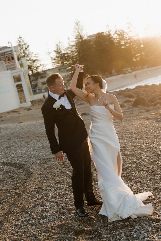 The Lou-Lou & Betsy wedding dress by KWH Bridal is a corset strapless draped gown with side split skirt detail for the modern minimal sexy bride