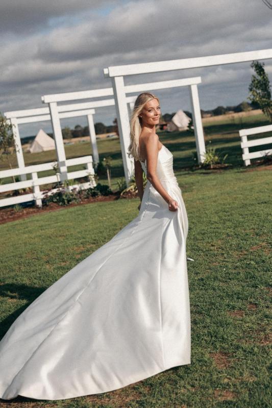 Claudia wears the Emma Mikado gown from the Bespoke collection at Karen Willis Holmes.