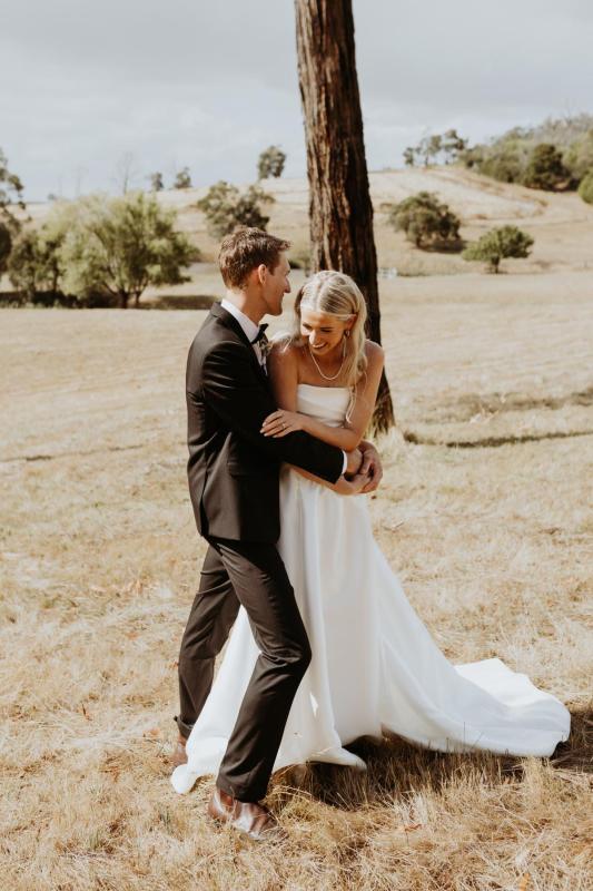 Emily wears the Lou Lou Dip gown from the Bespoke collection.