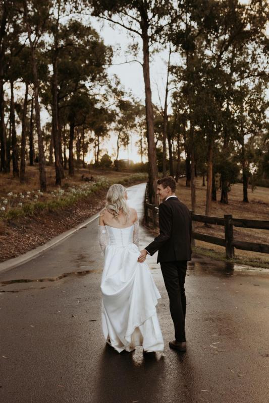 Emily wears the Lou Lou Dip gown from the Bespoke collection.