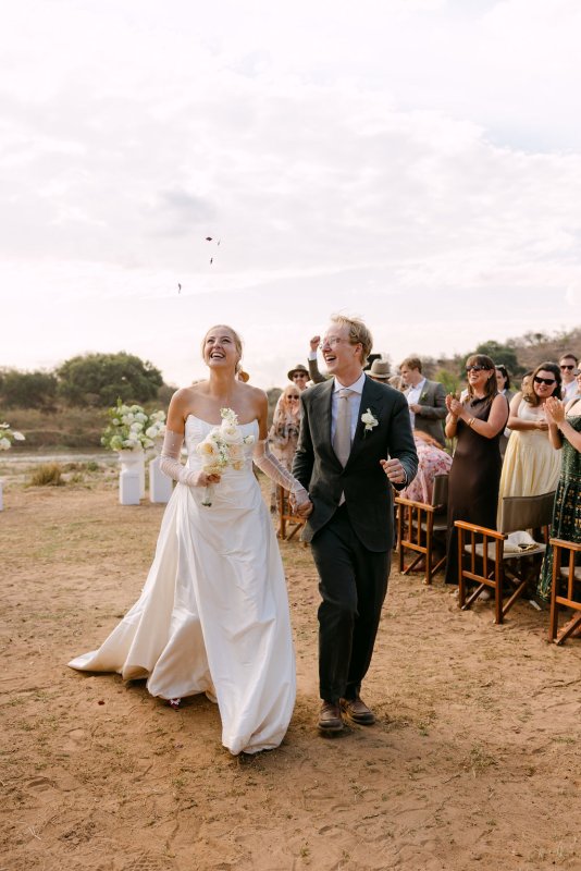 Rebecca and Blair during the ceremony. Rebecca is wearing our Emma Gown