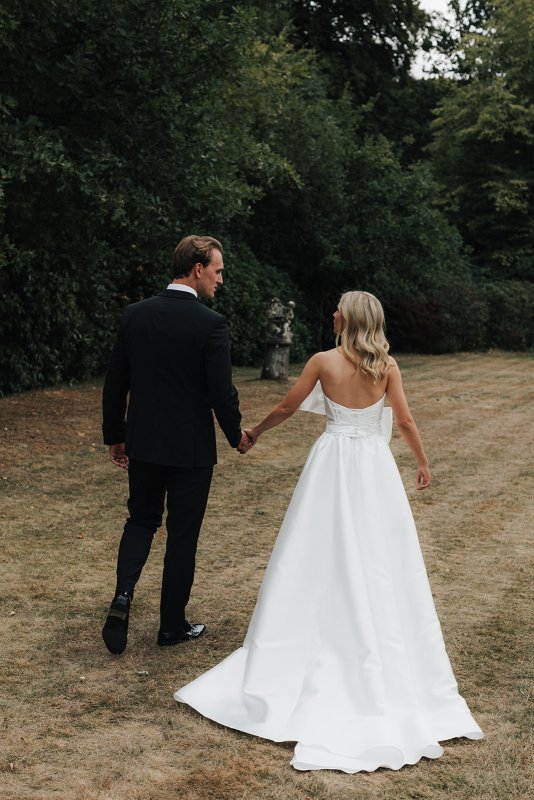 bride and groom with bride wearing ines and julianne gown